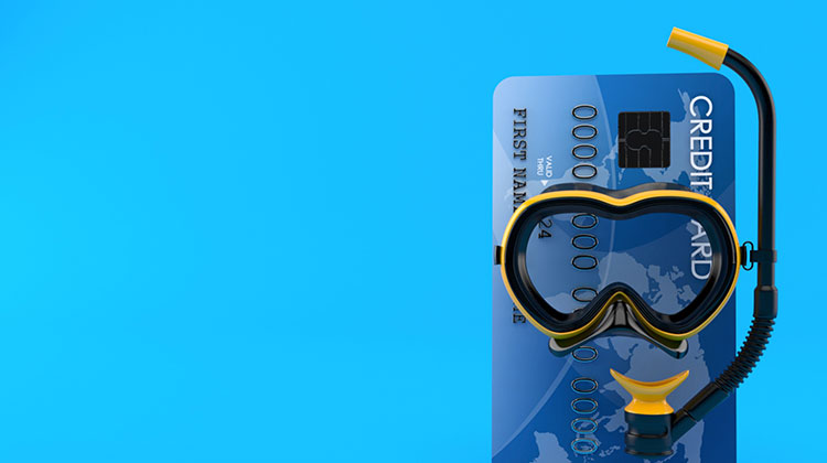 Kreditkarte mit Taucherbrille und Schnorchel